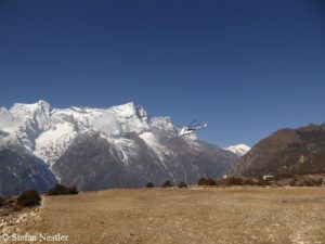 Helicopter takes off from Syangboche Airfield above Namche Bazaar