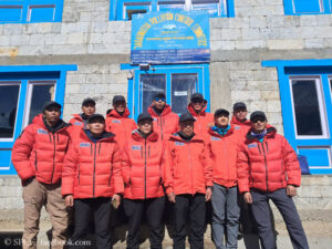 The Icefall Doctors and their team at base camp
